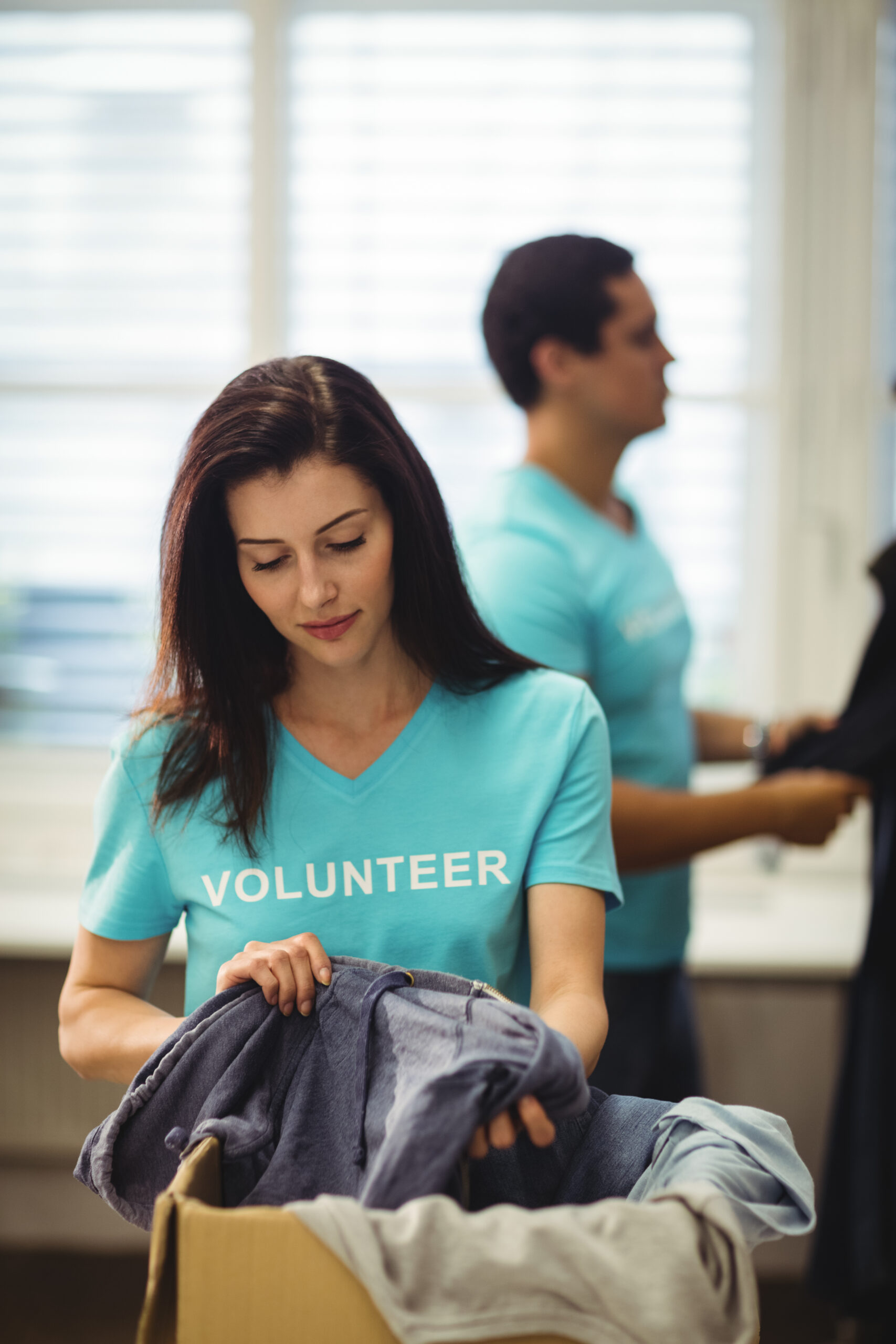 Female volunteer checking clothes